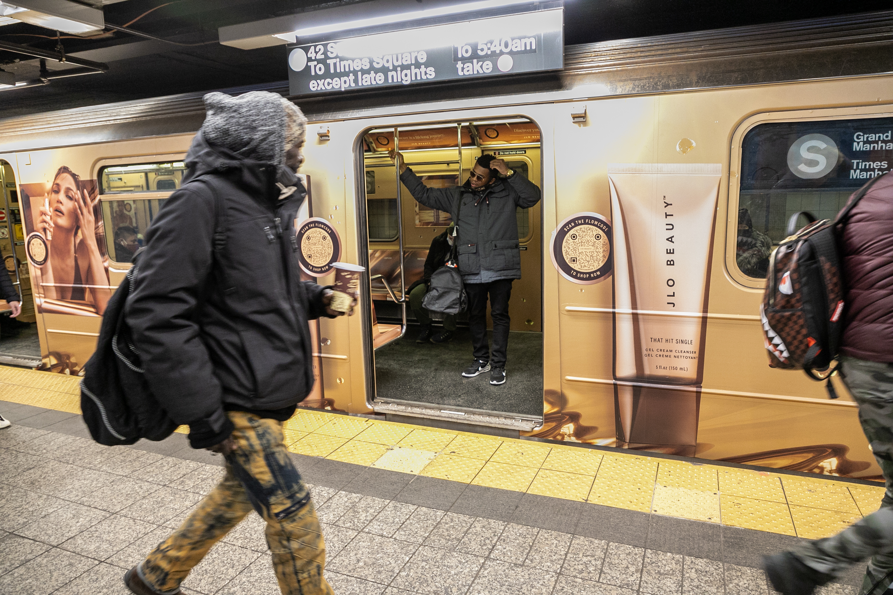 wrapped NYC subway train with jennifer lopez ad