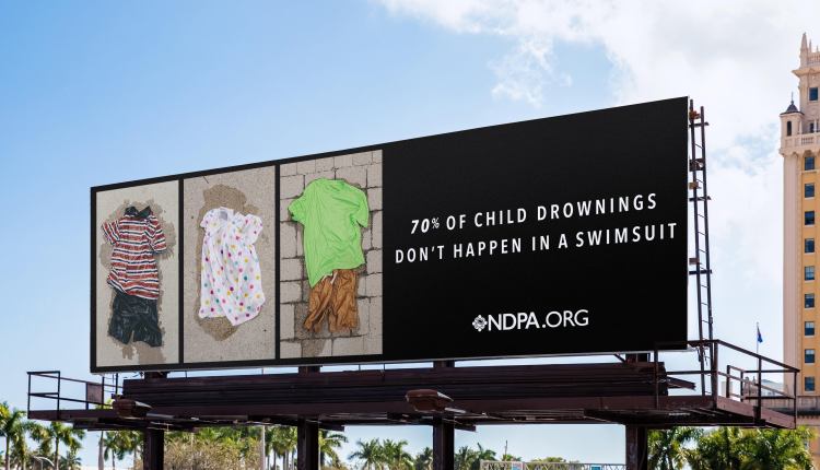 Billboard showing clothes children were wearing when they drowned.